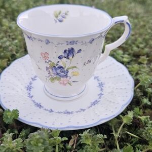 Nikko Ceramics White Teacup and Saucer with Blue Floral Accents